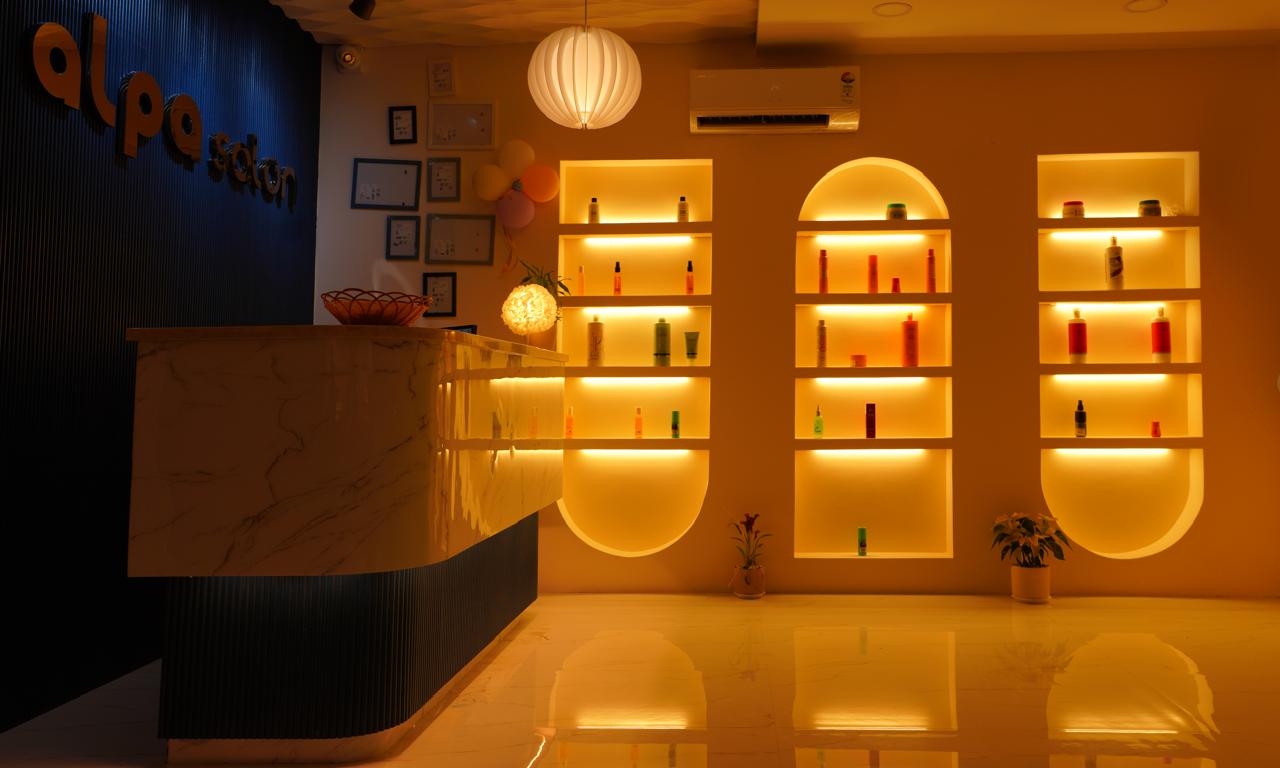 Warm backlit arched retail shelves with premium products at Alpa Salon