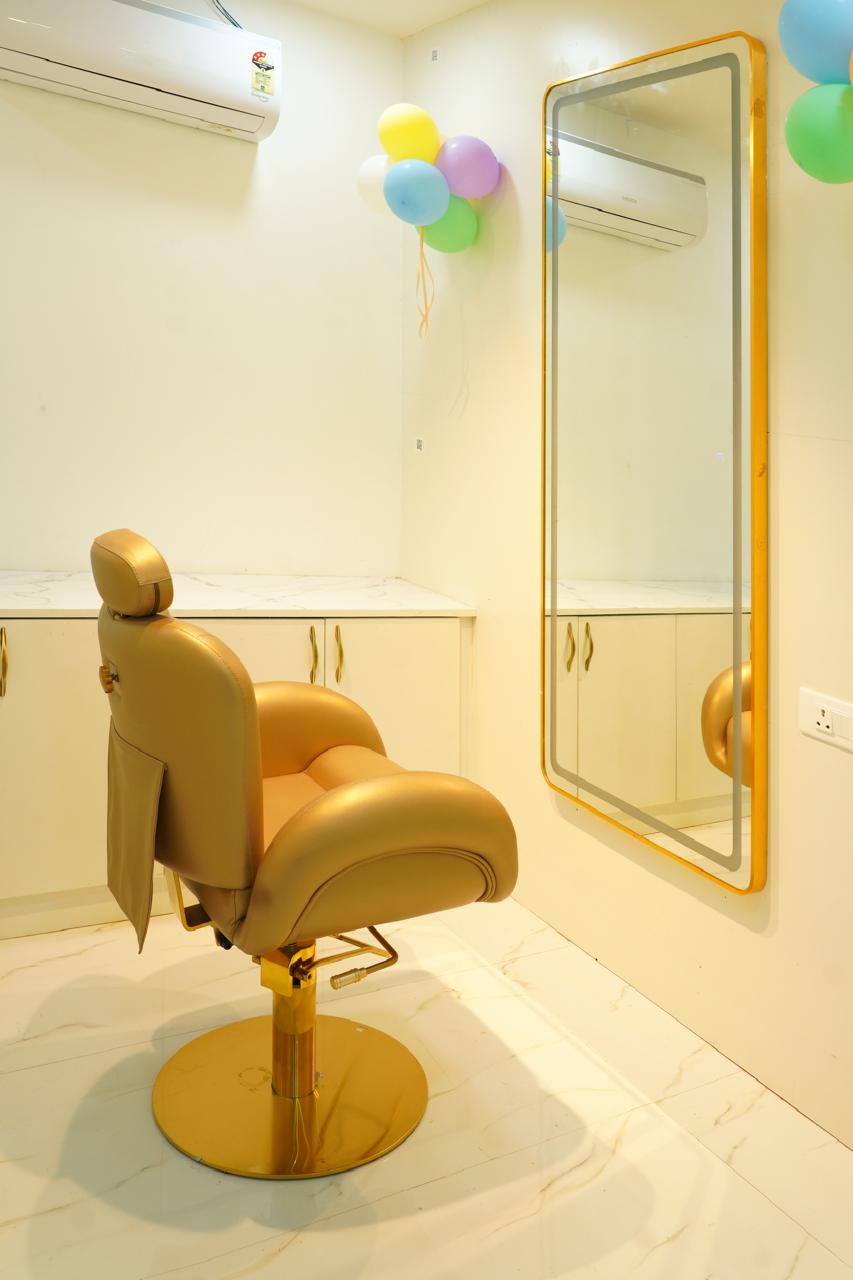 Gold makeup chair and gold-framed mirror in the Alpa bridal studio