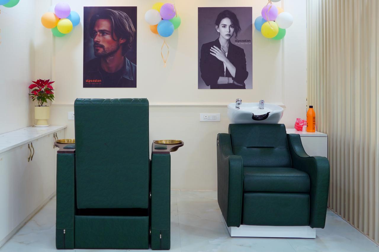 Hair-wash and pedicure area with twin emerald chairs