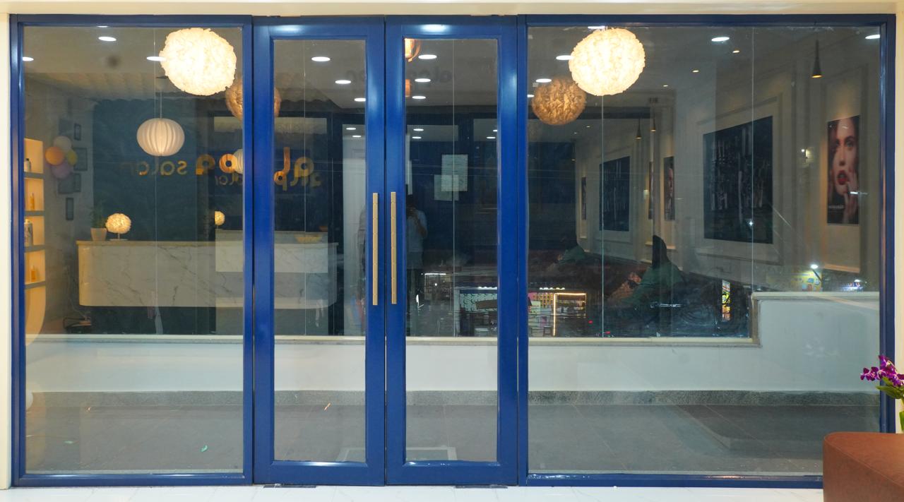 Blue-framed glass entrance doors